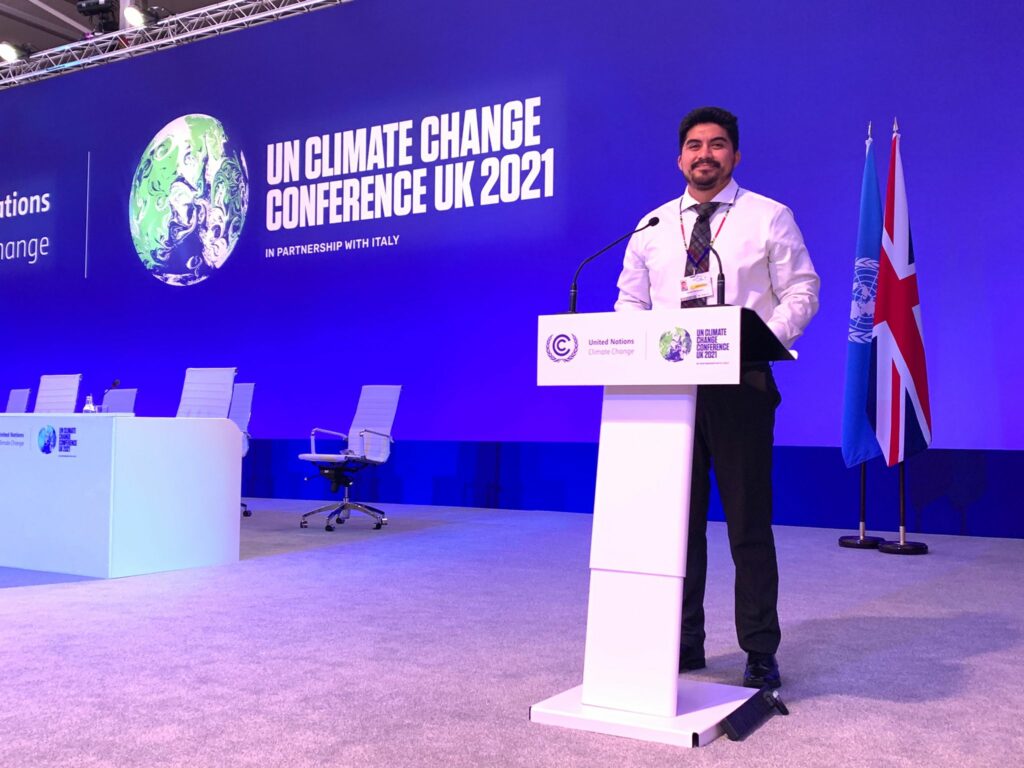 Daniel Dominguez behind the podium at the UN Climate Talks 2021